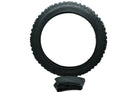 A black knobby bicycle tire shown upright against a solid black background, with a folded matching black inner tube resting below it.