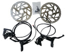 Bicycle disc brakes and rotors on a white background